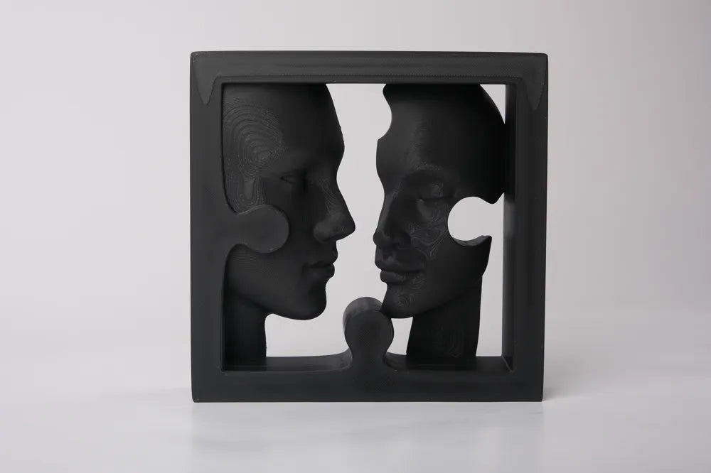 Puzzle Faces Sculpture